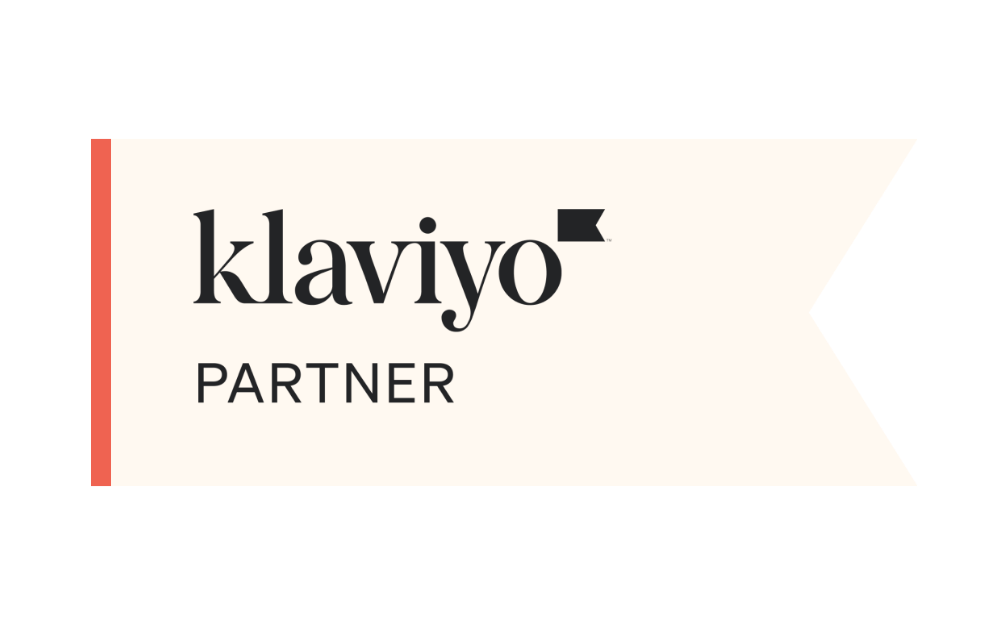 20 Certified Klaviyo Partner - UNTMD Digital Marketing Agency in Australia | UNTMD | Award-Winning Digital Marketing Agency in Australia Klaviyo Partner badge on a cream ribbon with an orange left edge